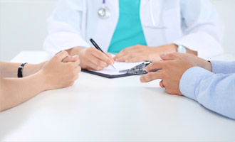 Child pointing to medical forms